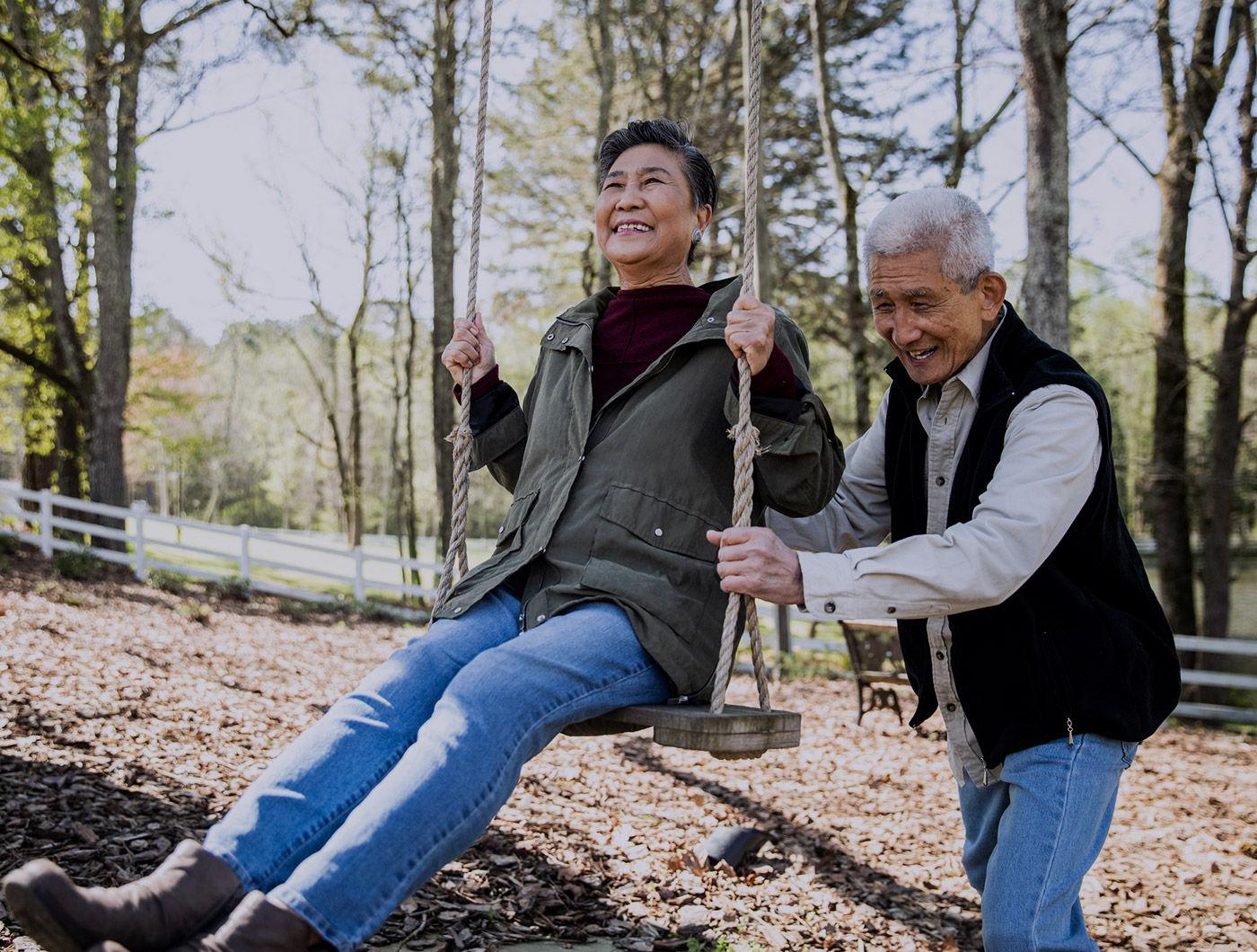 Couple having fun on the swing