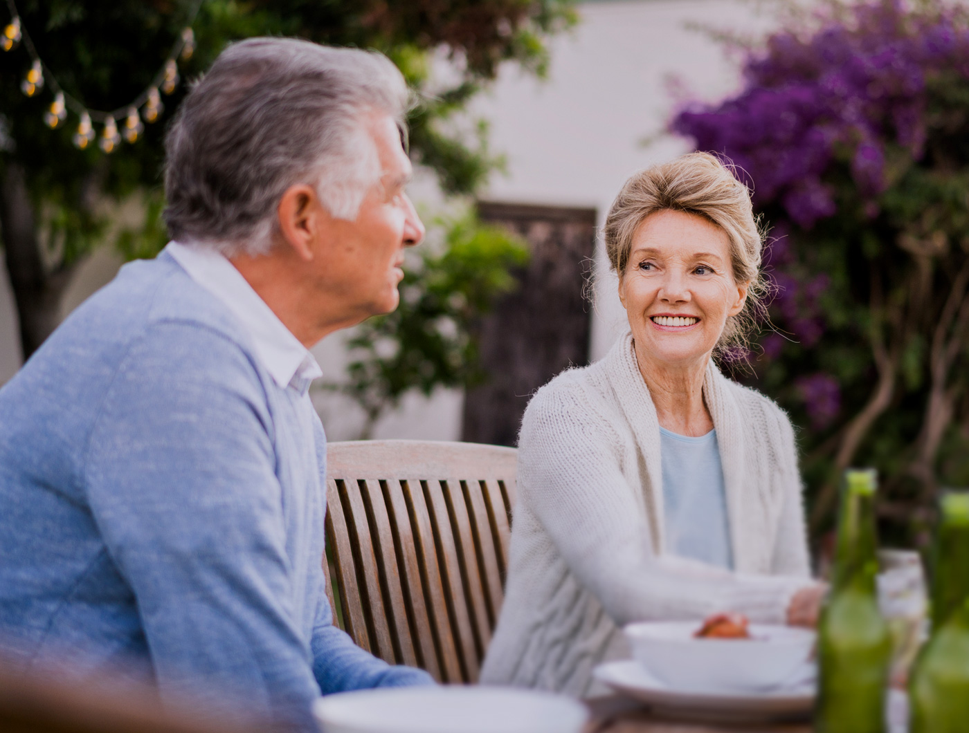 Two middle age couple talking on the bench